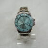 Silver circle body with Blue Dial