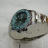 Silver circle body with Blue Dial