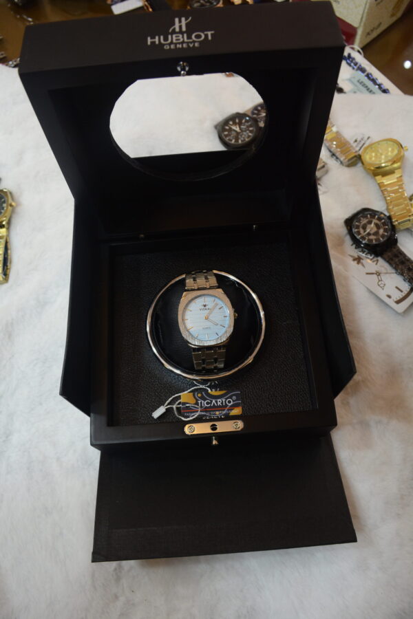 golden body light blue dial